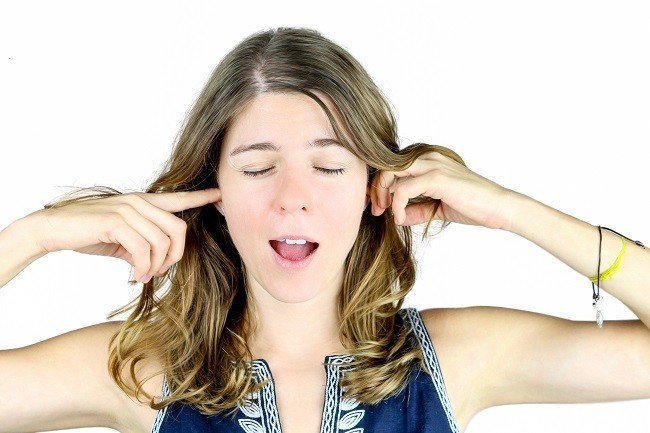 Refusing to listen to good advice Woman blocking her ears, refusing to listen to good breeding advice